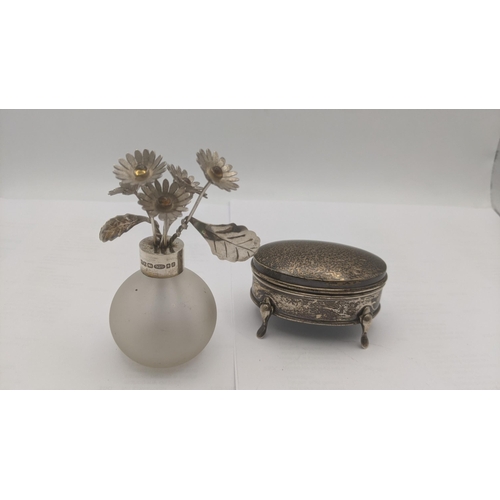 26 - A silver ring box in oval form on four feet together with a frosted glass and silver rimmed miniatur... 