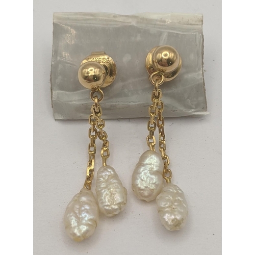 284 - A pair of 14ct yellow gold stud earrings with two pearl drops, 1.8g
Location: C5
If there is no cond... 