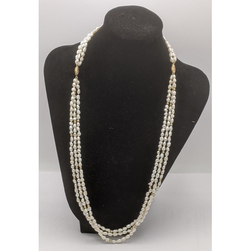 287 - A three strand pearl and gold ball strand necklace having a double 14ct yellow gold catch
Location: ... 