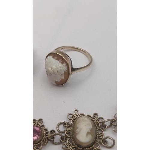 299 - A 9ct gold shell cameo ring, a pair of later earrings set in white metal and a white metal filigree ... 