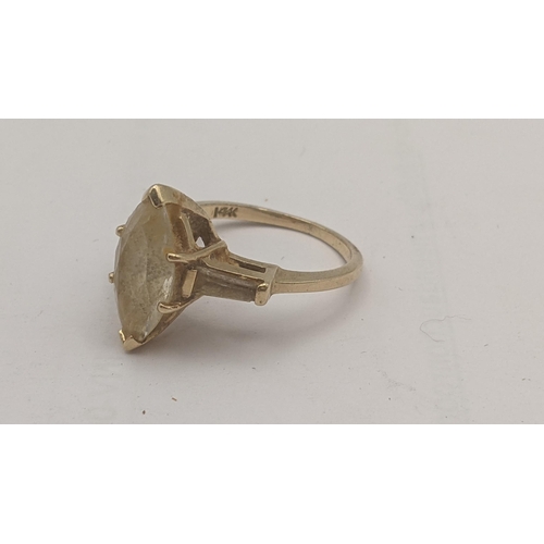 300 - A 14ct gold ring set with navette white stone, flanked by white stones to the shoulders, 4.2g
Locati... 