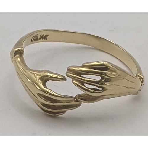 33 - A 14ct yellow gold bug ring in the form of two hands, size S, 2.6g
Location:RING1
If there is no con... 