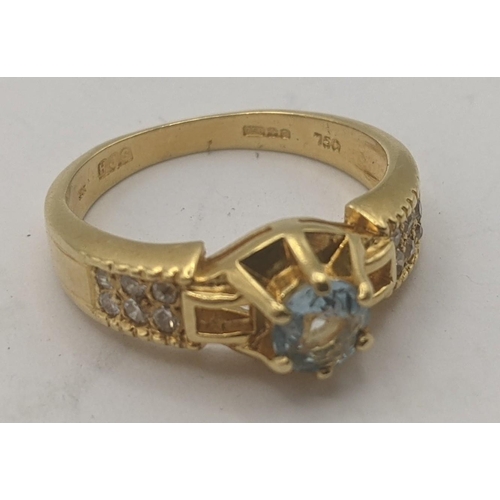 38 - An aquamarine and diamond 18ct yellow gold ring having a central brilliant cut aquamarine in a 6 cla... 