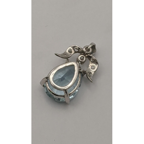 4 - A white metal pendant fashioned as an angel pendant set with pear faceted cut tourmaline in a four c... 