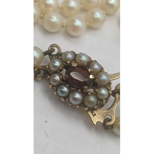 43 - A double strand of graduated pearls necklace on 9ct yellow gold and garnet clasp
Location:CAB
If the... 