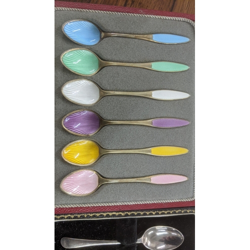 45 - Two cased sets of silver spoons to include a set of six sterling silver and enamel coffee spoons fro... 