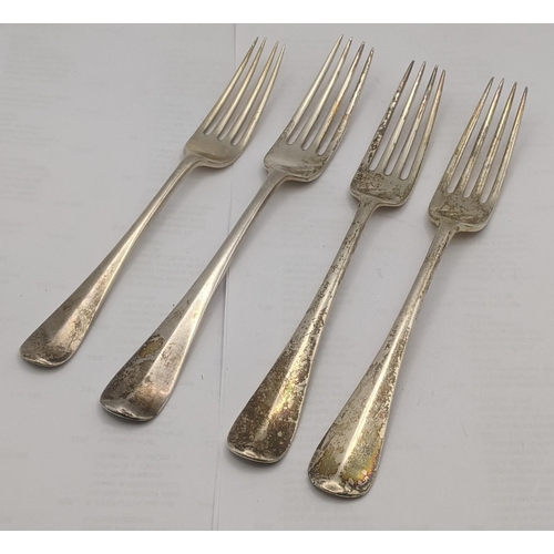 46 - Four silver dinner forks hallmarked London 1902 along with two others, all engraved with a family cr... 