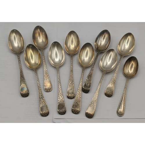 47 - A set of nine silver teaspoons having floral engraved terminals hallmarked Sheffield 1897 along with... 