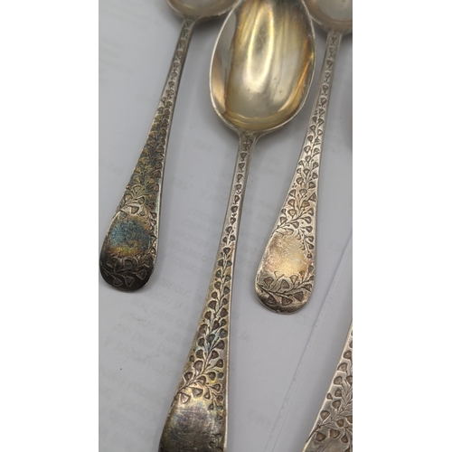 47 - A set of nine silver teaspoons having floral engraved terminals hallmarked Sheffield 1897 along with... 