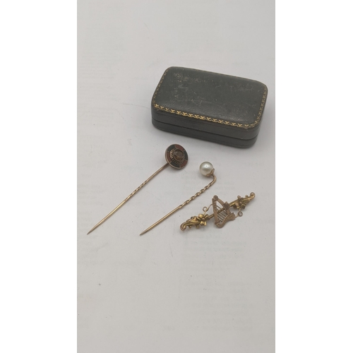 54 - Yellow gold to include: a 9ct and pearl stick pin, a yellow metal and enamel stick pin tested as 9ct... 