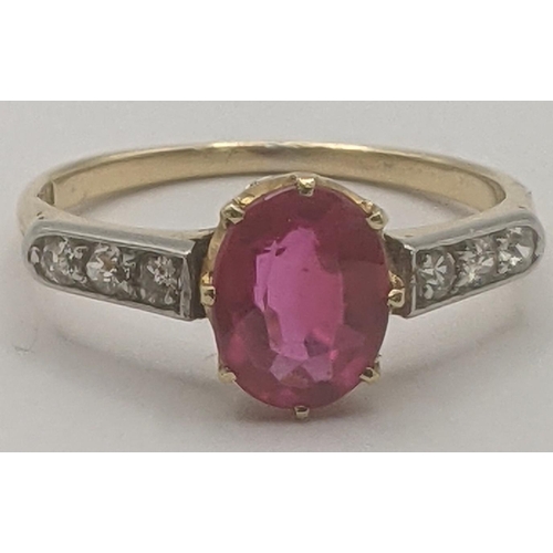 6 - 18ct yellow and white gold ring set with an oval cut ruby in a 8 claw setting flanked by three shoul... 