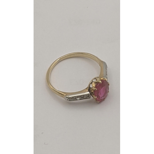 6 - 18ct yellow and white gold ring set with an oval cut ruby in a 8 claw setting flanked by three shoul... 