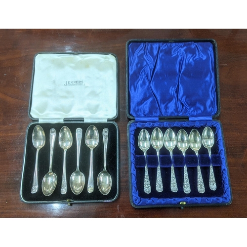 61 - Two sets of six silver teaspoons, one set having floral embossed handles, hallmarked Birmingham 1902... 