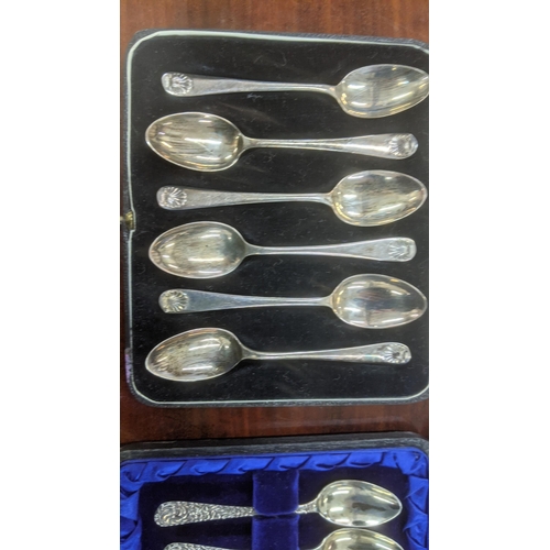 61 - Two sets of six silver teaspoons, one set having floral embossed handles, hallmarked Birmingham 1902... 