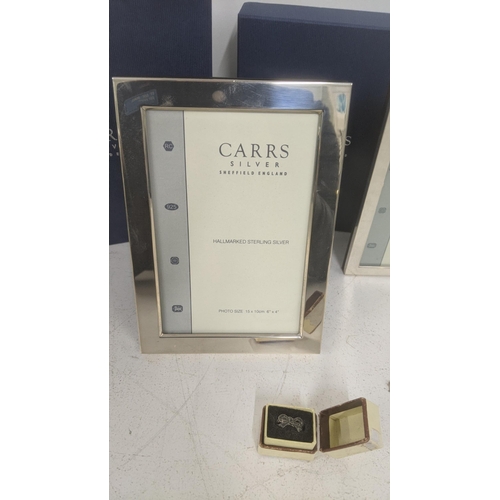 63 - Two Carrs of Sheffield silver photo frames with boxes and a silver ring
Location:A4M
If there is no ... 