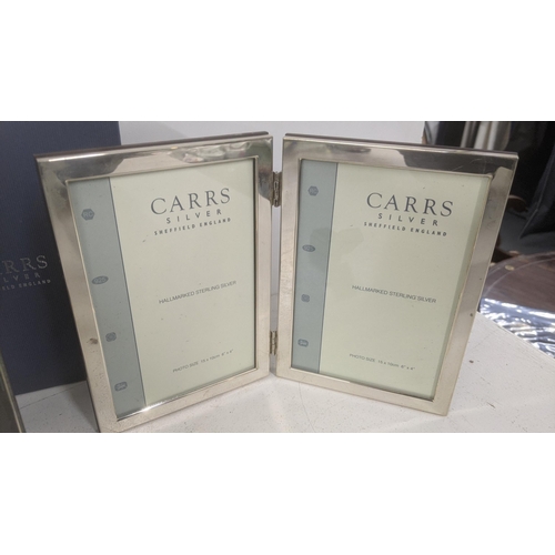 63 - Two Carrs of Sheffield silver photo frames with boxes and a silver ring
Location:A4M
If there is no ... 