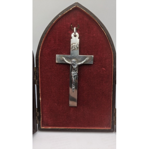 70 - A mixed lot to include a French silver crucifix housed in a  French travel leather shiny case togeth... 