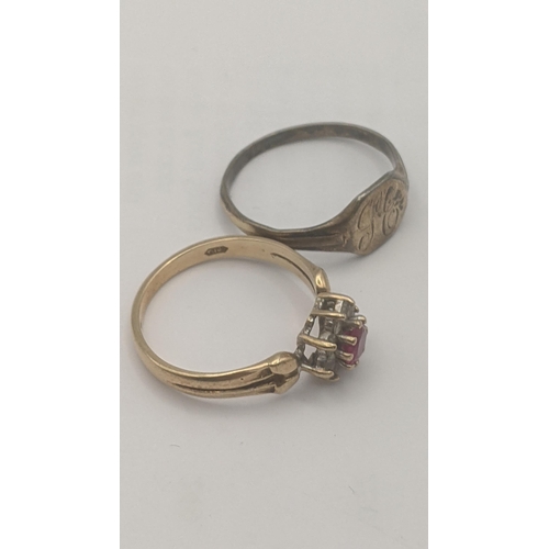 92 - Two rings to include a 9ct yellow gold ruby and sapphire daisy ring 2.4g together with a 9ct on silv... 