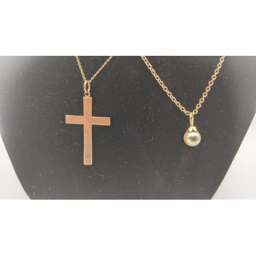 95 - A 9ct yellow gold cross pendant on a 9ct gold chain together with a 9ct gold and pearl drop pendant ... 