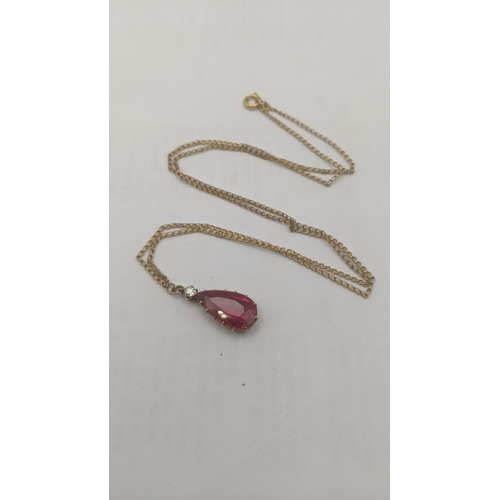 98 - A pear cut ruby and diamond drop pendant mounted in a yellow metal 14 claw setting tested as 14ct 1.... 