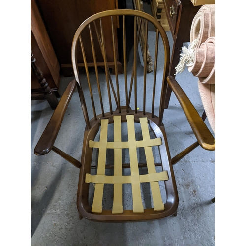 315 - An Ercol Quaker dining chair with loose upholstered seat and late mid-century Ercol dark wood armcha... 