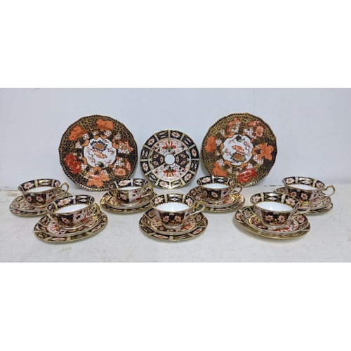 332 - A group of Royal Crown Derby Traditional Imari pattern set of seven trios, along with a matching lar... 