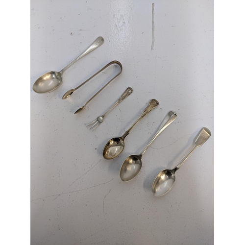 273 - A group of hallmarked silver flatware to include four teaspoons, a cake fork a pair of sugar tong, 1... 