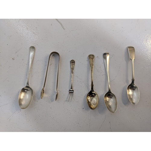 273 - A group of hallmarked silver flatware to include four teaspoons, a cake fork a pair of sugar tong, 1... 