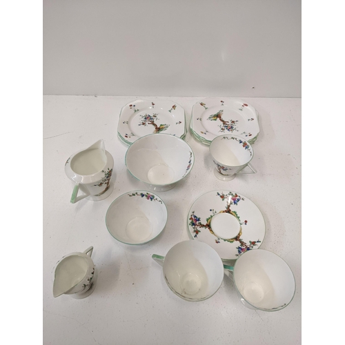 395 - A Shelley part tea set decorated with an apple tree and flowers
Location: 1-3
If there is no conditi... 