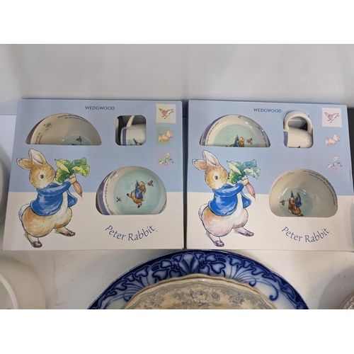 413 - A mixed lot of ceramics to include two boxed Wedgwood Peter Rabbit sets, a boxed mug, two chamber po... 