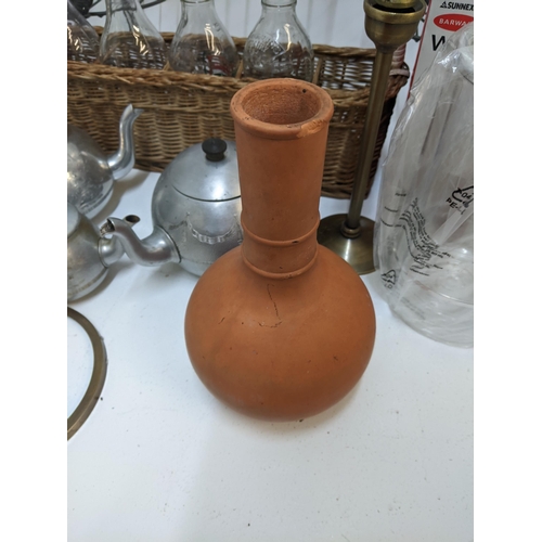 415 - A mixed lot to include a terracotta vase, three stainless steel teapots, two boxed modern wine coole... 