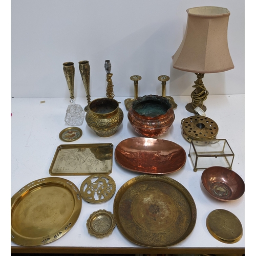 424 - A mixed lot to include a copper tray, two brass candlesticks, a copper pot, a brass pot, a crystal c... 