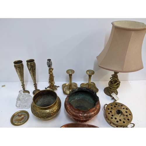 424 - A mixed lot to include a copper tray, two brass candlesticks, a copper pot, a brass pot, a crystal c... 