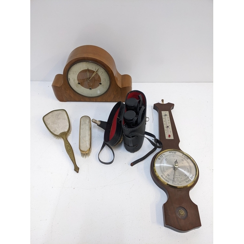 425 - A mixed lot to include a mid 20th century walnut mantel clock, two brass handled dressing table brus... 