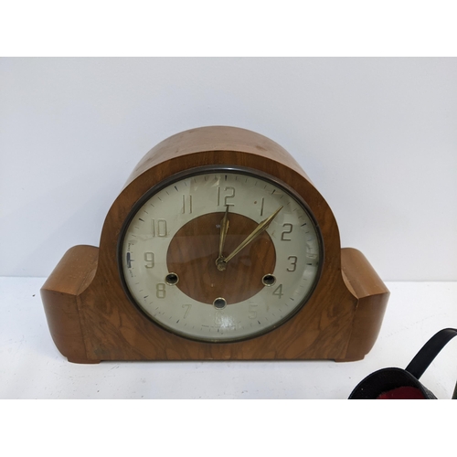 425 - A mixed lot to include a mid 20th century walnut mantel clock, two brass handled dressing table brus... 