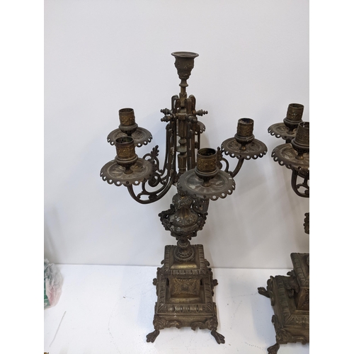 432 - A pair of late 19th century gilt spelter candelabra with lion mask ring handles on paw feet.
Locatio... 