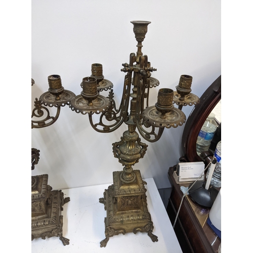 432 - A pair of late 19th century gilt spelter candelabra with lion mask ring handles on paw feet.
Locatio... 