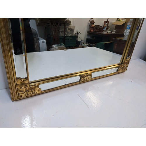 434 - A modern gilt framed mirror with floral ornament, measurements 69cm x 95cm
Location: RWM
If there is... 