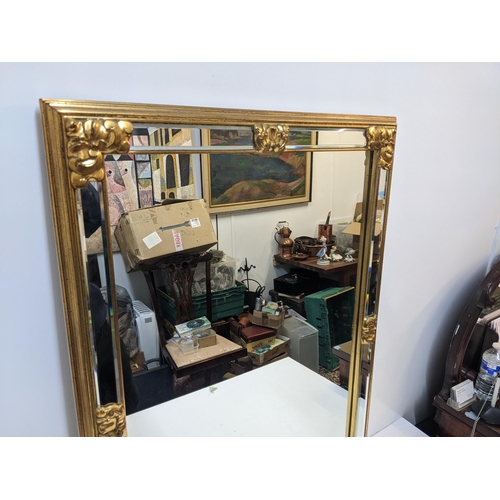 434 - A modern gilt framed mirror with floral ornament, measurements 69cm x 95cm
Location: RWM
If there is... 