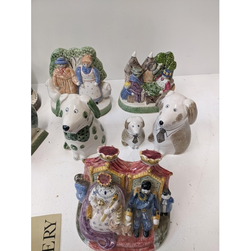 439 - A group of Rye pottery figures to include hop pickers, shepherd and shepherdess, the fisherman and w... 