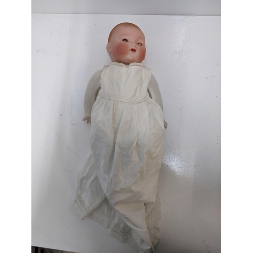 443 - An early 20th century china doll in a christening robe, marked 'A.M. Germany'
Location: 2-4
If there... 