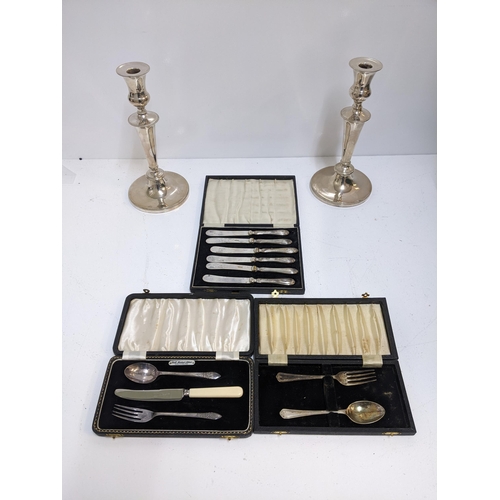 444 - A silver and silver plated items to include a pair o f silver plated candlesticks, a boxed set o f s... 