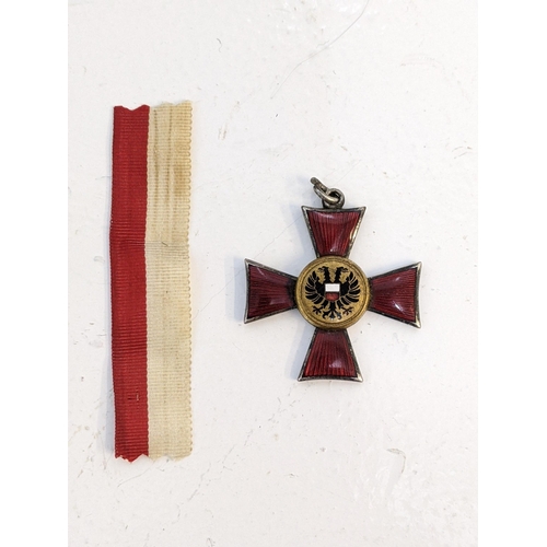 267 - An Imperial German Lubeck Hanseatic cross with a red and white ribbon Location: C7
If there is no co... 