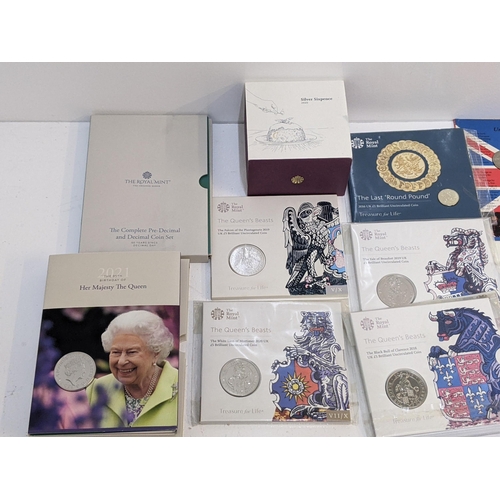 269 - Coins to include eleven sealed £5 coins from The Queen's Beasts Collection, a silver sovereign comme... 