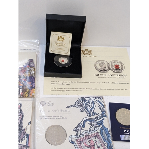 269 - Coins to include eleven sealed £5 coins from The Queen's Beasts Collection, a silver sovereign comme... 