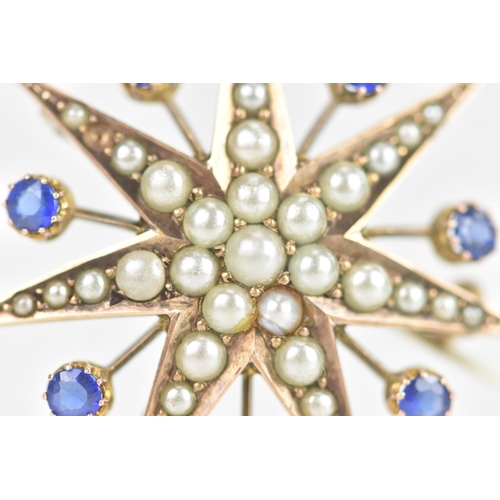 1 - An Edwardian 9ct gold split seed pearl and sapphire star brooch, seven point star with seven sapphir... 