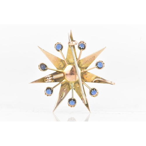 1 - An Edwardian 9ct gold split seed pearl and sapphire star brooch, seven point star with seven sapphir... 