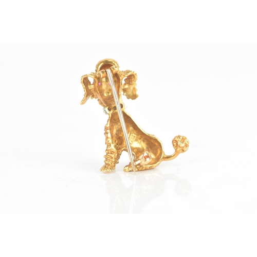 14 - An 18ct yellow and white gold brooch, fashioned as a poodle having ruby eyes, the collar inset with ... 