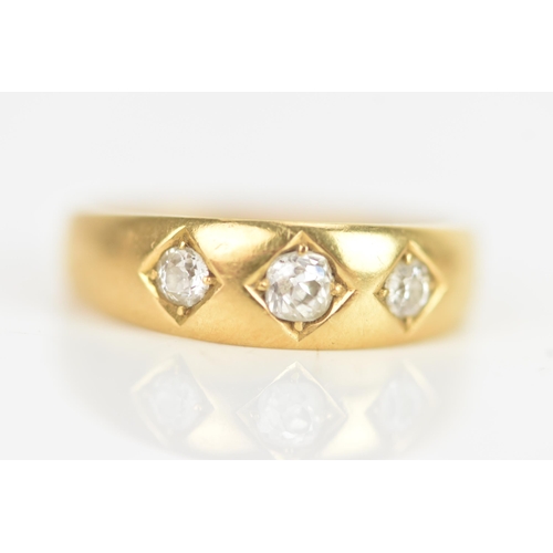 17 - A Victorian diamond 18ct yellow gold gypsy ring, set with three old cut diamonds in claw settings, t... 