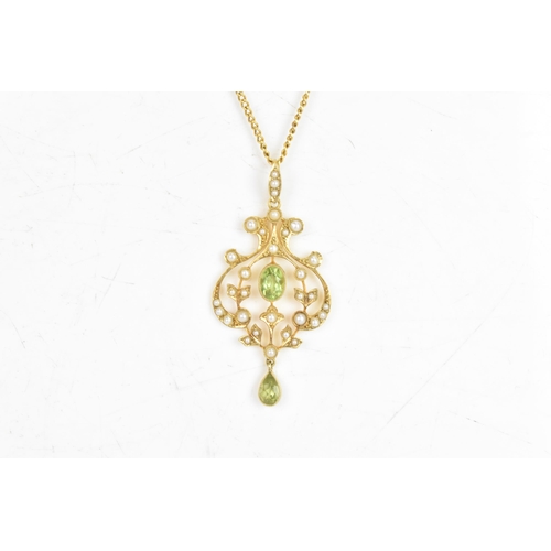 18 - An Edwardian peridot and seed pearl 15ct gold necklace, the attached pendant of foliate design, set ... 